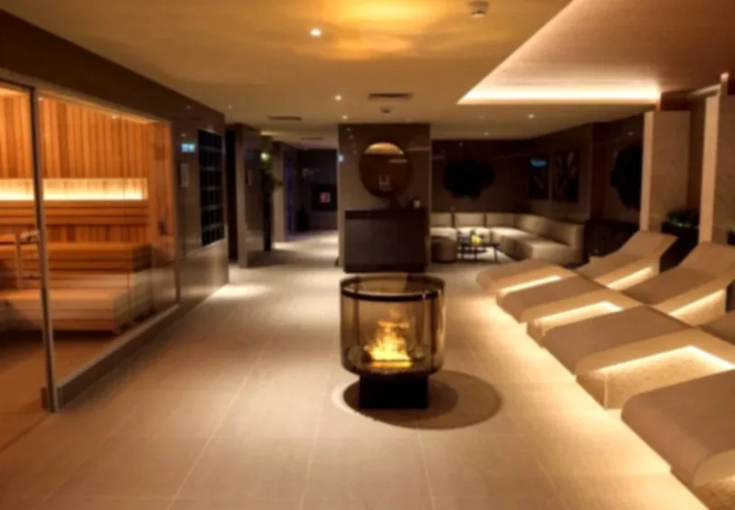 David Lloyd Amsterdam 2026 | Membership Prices, Opening Hours & Facilities Guide 4 Indoor wellness and relaxation area with warm lighting and minimalist interior