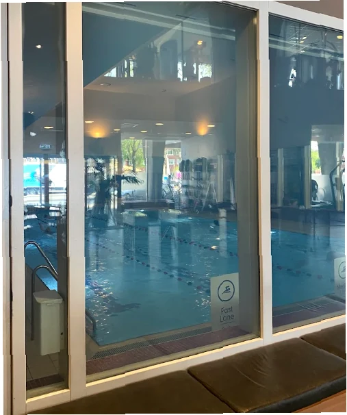 David Lloyd Amsterdam 2026 | Membership Prices, Opening Hours & Facilities Guide 7 Modern indoor lap pool with glass walls and calm atmosphere